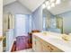Primary bathroom with a double vanity, wooden floors, shower and a closed toilet space at 6420 Conifer Cir, Indian Trail, NC 28079