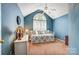 Bedroom featuring blue walls, carpet, a ceiling fan, and a daybed with accent pillows at 6420 Conifer Cir, Indian Trail, NC 28079