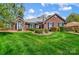 Charming brick home with manicured lawn and mature landscaping, creating inviting curb appeal at 6420 Conifer Cir, Indian Trail, NC 28079