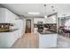 Well-lit kitchen features granite countertops, white cabinetry, and stainless steel appliances at 6420 Conifer Cir, Indian Trail, NC 28079