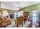 Bright living room features a fireplace, hardwood floors, and elegant furniture at 6420 Conifer Cir, Indian Trail, NC 28079
