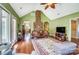 Open living room with hardwood floors, brick fireplace, and access to outdoor area at 6420 Conifer Cir, Indian Trail, NC 28079
