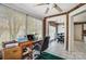 Bright sunroom office space with a large window and brick and white walls at 6420 Conifer Cir, Indian Trail, NC 28079