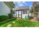 Backyard shed with double doors, surrounded by grass and greenery at 6420 Conifer Cir, Indian Trail, NC 28079