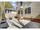 Backyard patio area with a modern fire pit and stylish outdoor seating at 68 Cabarrus W Ave, Concord, NC 28025