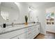 Bright bathroom featuring double sink vanity with granite counters and white cabinets at 68 Cabarrus W Ave, Concord, NC 28025