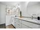Double sink vanity in bathroom featuring granite countertops and modern lighting at 68 Cabarrus W Ave, Concord, NC 28025