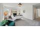 Bedroom featuring large windows, stylish decor, and comfortable accents at 68 Cabarrus W Ave, Concord, NC 28025