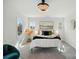 Sun-filled bedroom with large windows, stylish decor, and comfortable seating at 68 Cabarrus W Ave, Concord, NC 28025