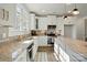 Well-lit kitchen featuring granite countertops, stainless steel appliances, and ample storage space at 68 Cabarrus W Ave, Concord, NC 28025