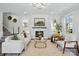 Bright living room with fireplace, comfortable seating, and hardwood floors at 68 Cabarrus W Ave, Concord, NC 28025