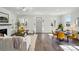 Bright, stylish living room featuring hardwood floors, a fireplace, and modern furniture at 68 Cabarrus W Ave, Concord, NC 28025