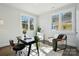 Bright office with large windows, desk, and chair, creating a comfortable workspace at 68 Cabarrus W Ave, Concord, NC 28025
