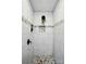 Modern shower with stylish pebble floor, marble-patterned walls, and built-in shelves at 68 Cabarrus W Ave, Concord, NC 28025