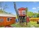 Unique backyard featuring a charming treehouse and shed, perfect for outdoor enjoyment at 6800 Deanwood Pl, Charlotte, NC 28217
