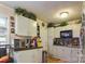 Efficient kitchen featuring white cabinets and modern appliances at 6800 Deanwood Pl, Charlotte, NC 28217