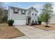 Charming two-story home with a well-manicured lawn and attached two-car garage at 7217 Cedarfield Rd, Charlotte, NC 28227