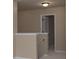 Hallway landing with a stairwell at 7217 Cedarfield Rd, Charlotte, NC 28227
