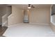 Spacious living room with neutral walls, stairs, and carpet flooring at 7217 Cedarfield Rd, Charlotte, NC 28227