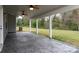 Covered patio features concrete flooring and ceiling fans for outdoor enjoyment at 7217 Cedarfield Rd, Charlotte, NC 28227