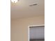 A close up of a window and ceiling shows the texture of the blinds and ceiling features at 7217 Cedarfield Rd, Charlotte, NC 28227