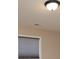 A close up of a window and ceiling shows the texture of the blinds and ceiling features at 7217 Cedarfield Rd, Charlotte, NC 28227