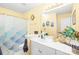 Inviting bathroom with white vanity, framed mirror, and shower with decorative curtain at 9025 J M Keynes Dr # 69, Charlotte, NC 28262
