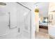Modern walk-in shower featuring sleek white subway tiles and safety grab bars at 9025 J M Keynes Dr # 69, Charlotte, NC 28262