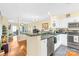 Open kitchen features updated stainless appliances and seamless flow to the living area at 9025 J M Keynes Dr # 69, Charlotte, NC 28262