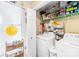 Functional laundry area with washer, dryer, shelving, and additional storage space at 9025 J M Keynes Dr # 69, Charlotte, NC 28262