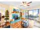 Comfortable living room boasts wood floors, modern fireplace, and access to balcony at 9025 J M Keynes Dr # 69, Charlotte, NC 28262