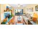 Inviting living room featuring a fireplace, wood floors, and sliding doors to the balcony at 9025 J M Keynes Dr # 69, Charlotte, NC 28262