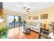 Bright living room features wood floors, neutral colors, and large sliding glass doors at 9025 J M Keynes Dr # 69, Charlotte, NC 28262