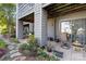 Cozy patio space with outdoor furniture and lush landscaping at 9025 J M Keynes Dr # 69, Charlotte, NC 28262