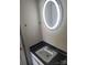 Bathroom with sink and a circular mirror provides illumination at 9156 Black Heath Cir, Charlotte, NC 28214