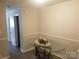 Cozy dining room featuring decorative wall trim, neutral paint and a glass table with decorative centerpiece at 9156 Black Heath Cir, Charlotte, NC 28214
