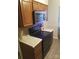 A functional kitchen features an electric range with microwave, countertops, and wood cabinets at 9156 Black Heath Cir, Charlotte, NC 28214