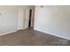 Open-concept living room with modern flooring, neutral paint, closet, and lots of natural light at 9156 Black Heath Cir, Charlotte, NC 28214