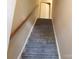 Carpeted staircase with wooden handrail leads to upper level at 9156 Black Heath Cir, Charlotte, NC 28214