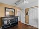 Bedroom featuring a dark wood dresser, hardwood floors, neutral walls, and a closet at 1008 Autumn Ln, Concord, NC 28025