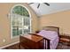 Bedroom with a large window, vaulted ceiling, and dark wood furnishings at 1008 Autumn Ln, Concord, NC 28025