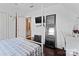 Bedroom with white walls, a full-length mirror, and a view of an ensuite bathroom at 1008 Autumn Ln, Concord, NC 28025