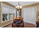 Cozy breakfast nook with wood table, seating, and a large window providing natural light at 1008 Autumn Ln, Concord, NC 28025