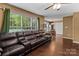 Cozy dining area with hardwood floors, stainless steel appliances, and backyard views at 1008 Autumn Ln, Concord, NC 28025
