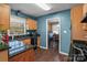 Galley-style kitchen featuring wooden cabinets, black countertops, and stainless steel appliances at 1008 Autumn Ln, Concord, NC 28025