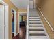 Unique staircase with custom painted lettering on each step leading to the upper level at 1008 Autumn Ln, Concord, NC 28025