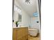 Bright bathroom featuring a modern vanity, soaking tub, and skylight at 1031 Lester Trl, Iron Station, NC 28080