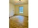 Inviting bedroom with wood-look flooring and ample natural light at 1031 Lester Trl, Iron Station, NC 28080