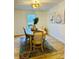 Bright dining room with natural light, featuring a wooden table and decorative wall art at 1031 Lester Trl, Iron Station, NC 28080