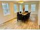 Sunny dining room with a large table perfect for entertaining at 1031 Lester Trl, Iron Station, NC 28080